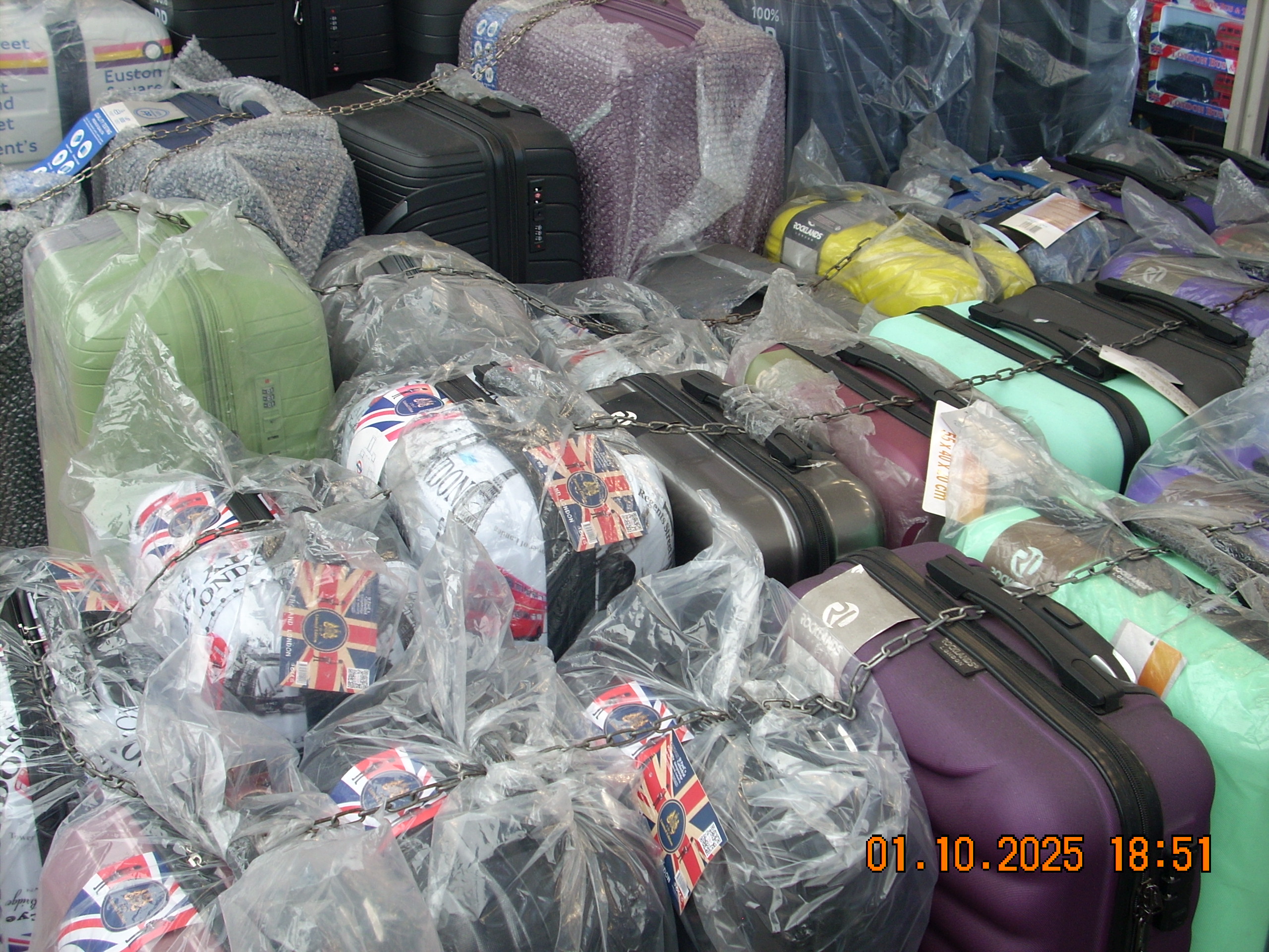 plastic wrapped suitcases